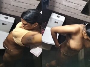 Tamil girl changing dress after pissing caught on