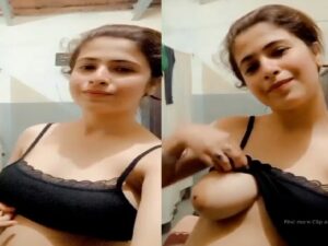 cute girl lifting bra and showing big white